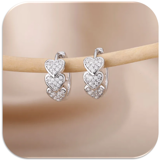 Women’s Silver-Tone Earrings with Three Vertically Aligned Hearts. (LFA1422009)